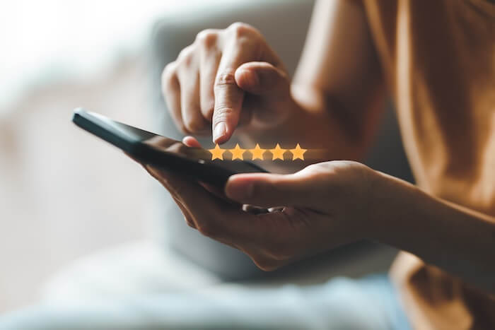 closeup of a woman giving a 5 star review