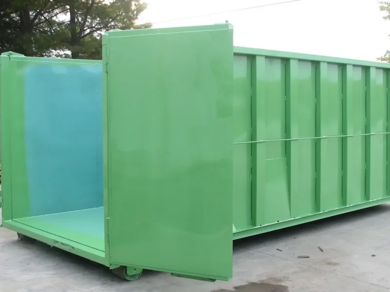 green dumpster with doors open