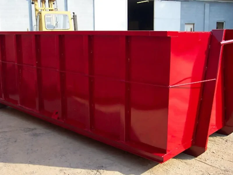 Red hooklift dumpster